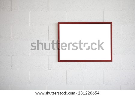 Blank picture frame at the brick wall with copy space and clipping path for the inside. White block wall.