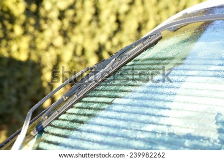 Winter windshield wipers for cars. Transportation, winter, weather and vehicle concept