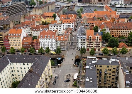 COPENHAGEN, DENMARK - 27 July 2015: Bird\'s eye view of the city. Panorama of colorful roof tops and old churches in Copenhagen, Denmark