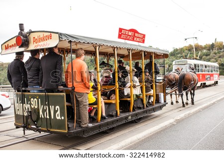 PRAGUE, CZECH REPUBLIC - SEPTEMBER 20, 2015: The vintage excursion tram parade goes on the central city street in Prague. 140 years of public transport.