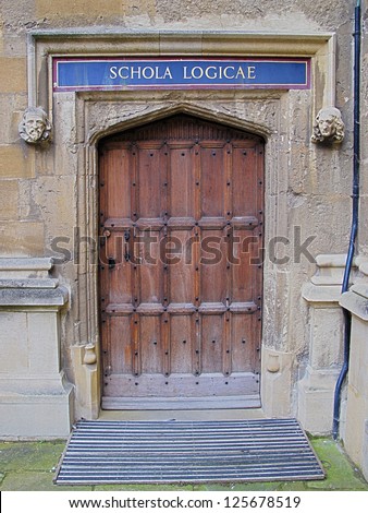 Carved wooden door at entrance to School of Logic, Bodleian Library, Oxford, United Kingdom.