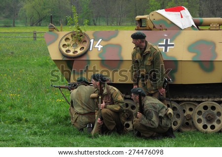 DOBRANY, CZECH REPUBLIC - MAY 1, 2015: British soldiers behind german vehicle. Liberation festival to 70th Anniversary of the Liberation by the US Army and the End of the Second World War in Europe.