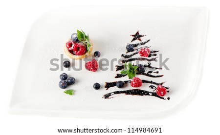 sweet christmas tree with berries and mint isolated on white