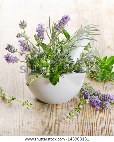 Fresh herbs on a wooden table