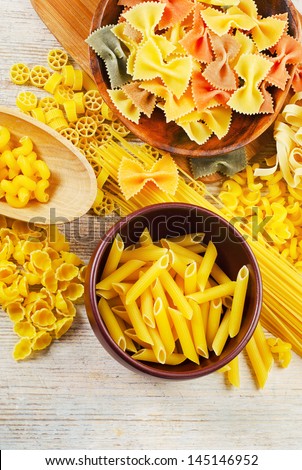 assortment of pasta on a wooden table