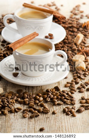 Two cups of espresso  on a wooden table.Selective focus