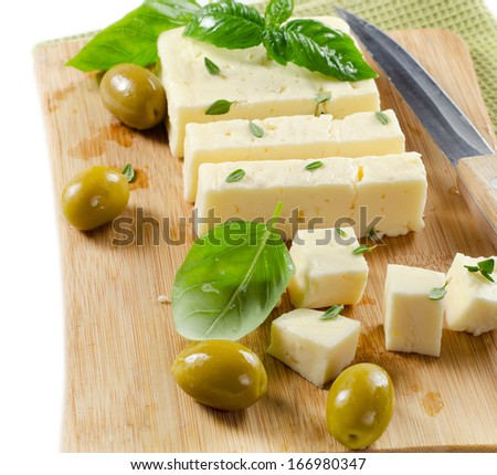 Feta cheese on a wooden platter .Selective focus