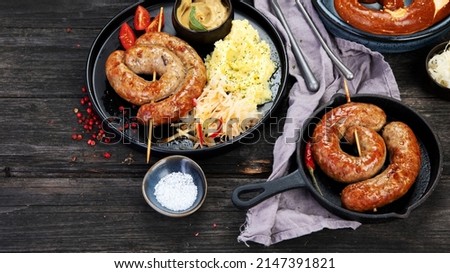 Grilled German sausages on wooden background. Traditional food concept. Grilled meat and snacks. copy space Foto stock © 