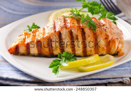 Grilled Salmon with lemon and  herb. Selective focus