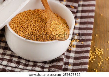 Mustard seeds in the  bowl . Selective focus