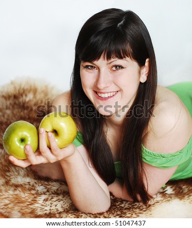 Happy woman with two apples