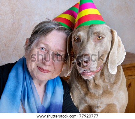 woman and dog with party hats