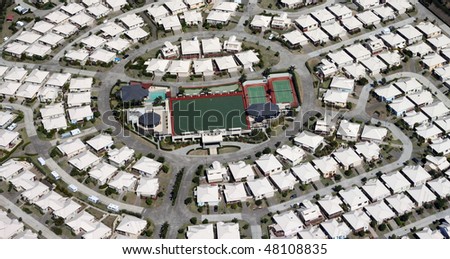 Aerial view of a a planned residential retirement community around recreational facilities