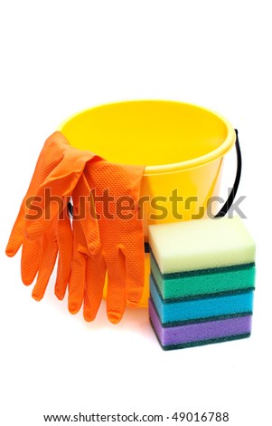 Yellow bucket, gloves and sponges to wash dishes on a white background