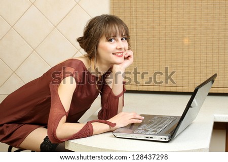 Normal girl smiling at the computer