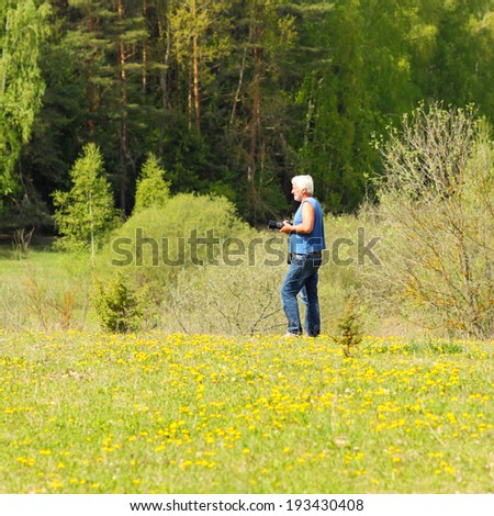 Elderly man traveling and photography nature. Elderly man enjoys traveling and photography nature.
