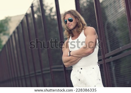 handsome man with sunglasses. portrait of a brave man