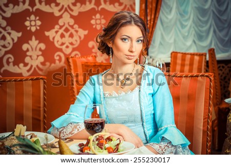 Girl in vintage dress in the restaurant. elegant pretty woman in vintage evening dress. Retro Woman Portrait. Romantic Beauty.Vintage Styled