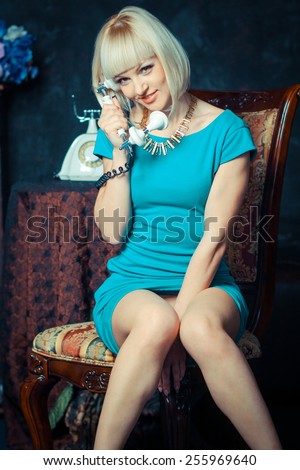 girl talking on retro telephone. sexy seductive woman with a vintage telephone