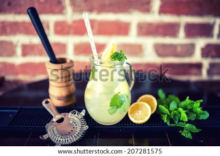 fresh mint lemonade with ingredients in a jug. vintage effect