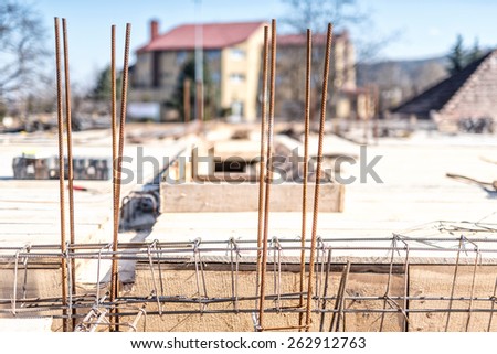 industrial construction site, cement preparation in foundation and reinforcement of steel bars, wooden boards and steel