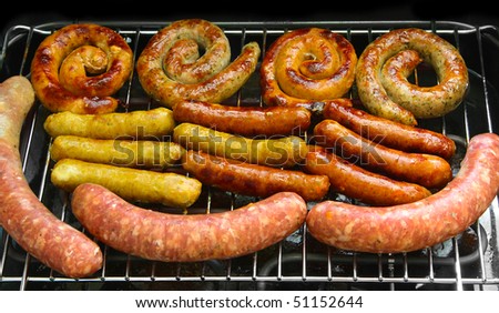 Fried sausages on an electric grill