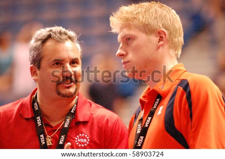 HARTFORD, CT - AUGUST 11: University of Illinois coaches Yin Alvarez and Justin Spring (Olympic medalist) at the VISA National Gymnastics Championships on August 11, 2010 in Hartford, Connecticut.