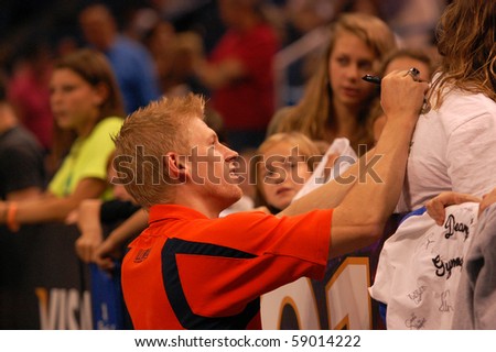 HARTFORD; CT - AUGUST 13: Olympic bronze medalist Justin Spring, gymnastics coach at University of Illinois, signs autographs at the VISA Gymnastics Championships on August 13, 2010 in Hartford; CT