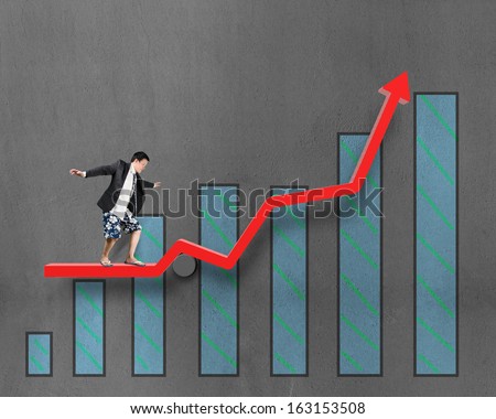 Businessman surfing on growth red arrow with histogram drawing on concrete wall background