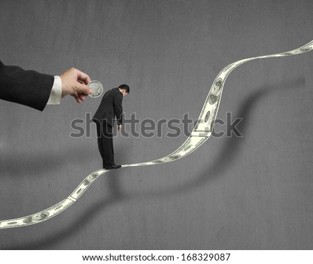Hand insert coin into businessman back hole which standing on growing money trend with concrete wall background