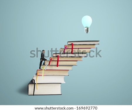 Businessman climbing on stack of books with growing bulb in blue background