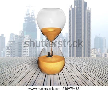 businessman was flooded in sand clock with city skyscraper and wooden floor
