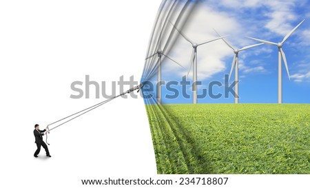 businessman pull open wind turbines curtain covering blank white background, environmental protection and alternative energy concept