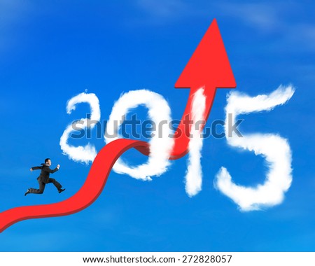 Businessman running on red arrow upward bending trend line breaking through 2015 shape clouds and blue sky background