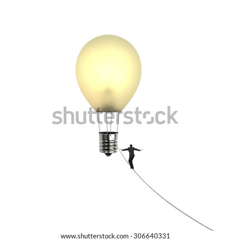 Businessman walking tightrope toward yellow lightbulb shape hot air balloon, isolated on white background.