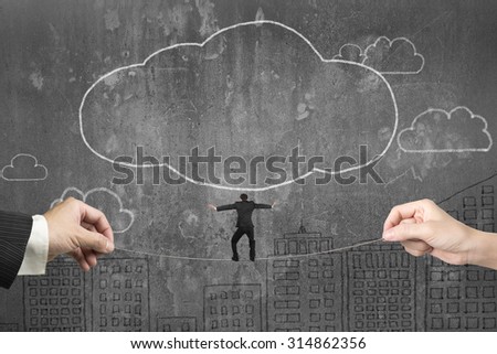 Businessman balancing on tightrope with male and female hands holding two sides, on clouds shape doodles concrete wall background.