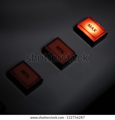 Illuminated max button on industrial power control panel. Selective focus