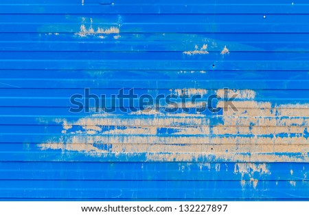 Horizontal ridged blue painted old metal wall background texture