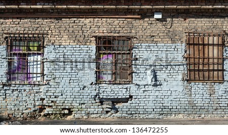 Old abandoned building wall texture with locked windows