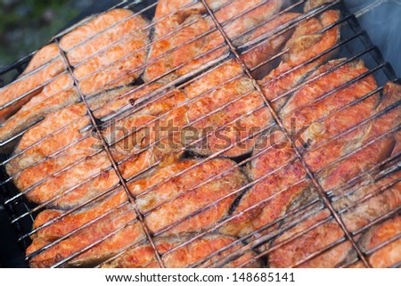 Grilled salmon fish steaks background