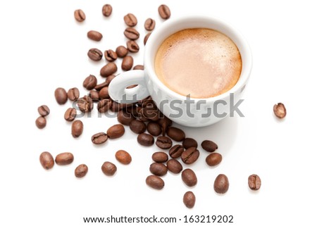 Small espresso cup with coffee beans isolated on white
