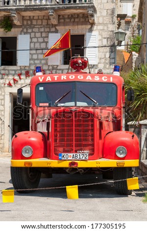 PETROVAC, MONTENEGRO - JULY 15, 2013: Photo of red firefighters truck based on FAP1314. FAP is a Serbian automotive manufacturer of trucks and buses founded in 1952