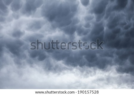 Dark gray stormy cloudy sky natural photo background