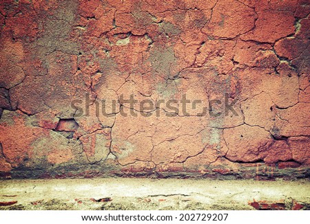 Old weathered red concrete wall texture. Instagram toned effect