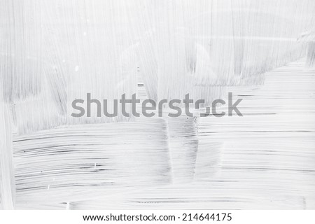 White paint layer on glass wall, background texture