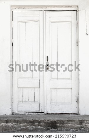 White wall and wooden door, background texture
