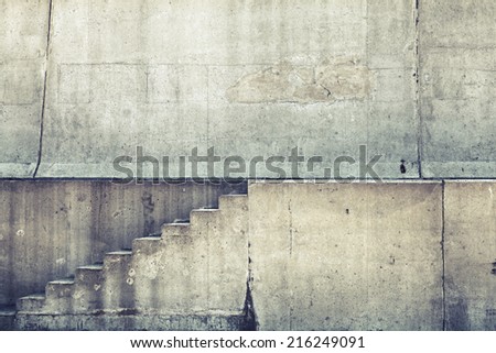 Concrete interior with stairway on the wall, vintage toned background