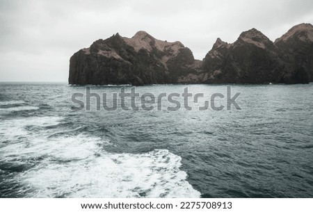 Similar – Image, Stock Photo Rocky island in sea against sunset sky aerial view