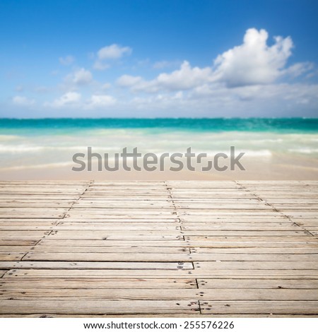 Square photo with empty wooden pier and blurred sea landscape on a background