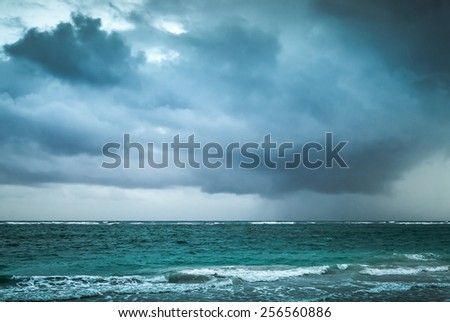 Stormy clouds over Atlantic ocean. Landscape with dramatic stormy sky, Dominican republic. Punta Cana. Blue toned photo with contrast filter effect
